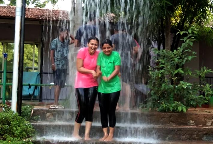 Group of guests enjoying a lively rain dance at Magenta Resort