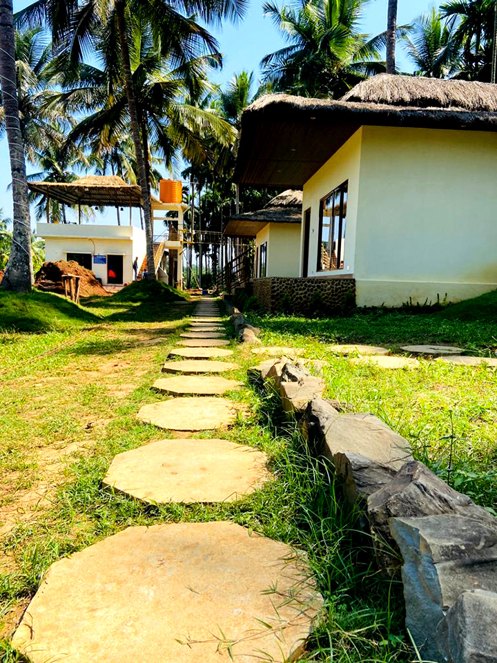 Aerial view of Magenta Resort surrounded by lush greenery in Dandeli