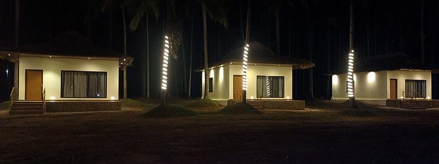 night view of cottages in dandeli